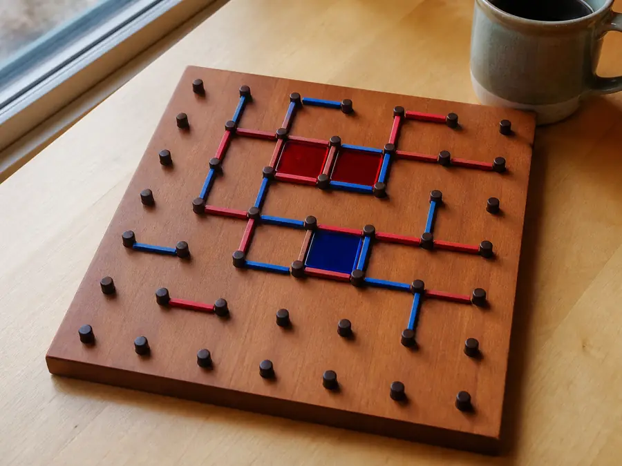 Dots and Boxes opening: a 5×5 box grid with Blue to move first